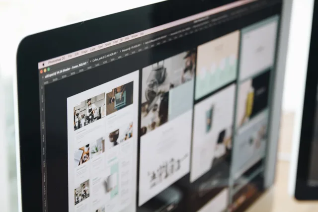 A modern computer screen displaying web design work, showcasing creative visuals in a workspace. E-handelsstatistik i Danmark: Hvilke kilder kan bruges?